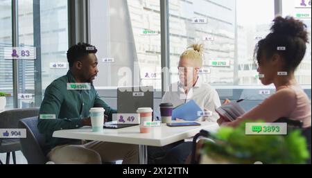 Image of changing numbers, icons in notification bars, diverse coworkers discussing reports Stock Photo