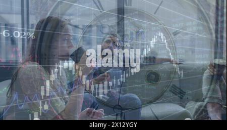 Image of clock and financial data processing over diverse business people in office Stock Photo