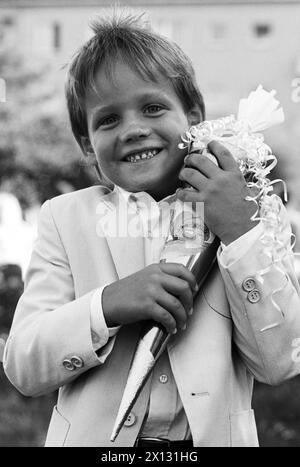 The photo was taken on September 7th 1987 on the occasion of the beginning of school in Lower Austria and the Burgenland after the summer break and shows a little boy named David holding a cornet of cardboard filled with sweets and little presents given to children in Austria on their first day at school. - 19870907 PD0002 - Rechteinfo: Rights Managed (RM) Stock Photo