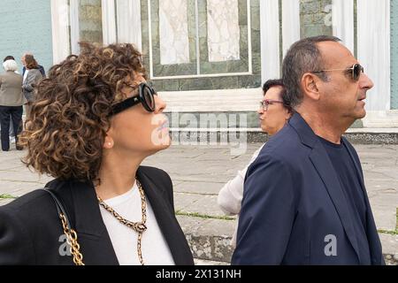 Florence, . 15th Apr, 2024. Florence, Roberto Cavalli's funeral at the Church of San Miniato al Monte In the photo Carlo Conti with his wife 04/15/2024 Florence Italy Credit: Independent Photo Agency/Alamy Live News Stock Photo