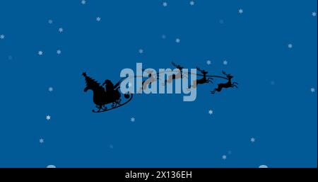 Image of santa claus in sleigh with reindeer over snow falling on blue background Stock Photo