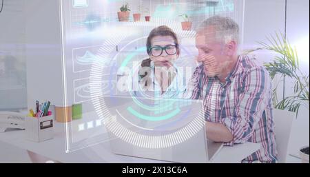 Image of data processing over caucasian male ad female fashion designers discussing at office Stock Photo