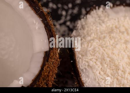white coconut pulp and dried coconut flakes, a close-up of which is used in the preparation of desserts Stock Photo