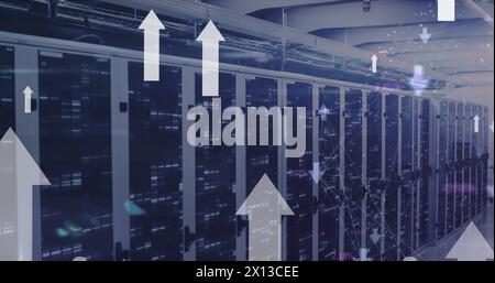 Image arrow moving upwards over illuminating data server racks Stock Photo