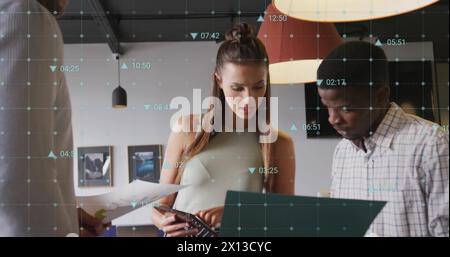 Image of changing numbers and icons over diverse coworkers discussing reports Stock Photo