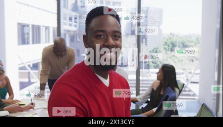 Image of multiple notification bars over smiling african american man looking at camera Stock Photo