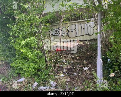 Damage to the undergrowth after a vehicle involved in the accident was removed. Three people have died and another has been left critically injured in a car crash near the Staples Corner retail park in west London. Picture date: Monday April 15, 2024. Stock Photo