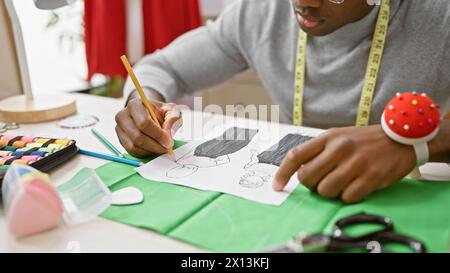 African American man tailor draw dress pattern on paper. Craftsman ...