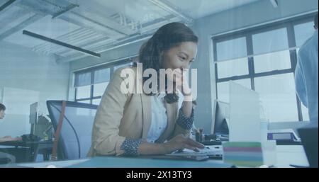 Business people using laptops in an office Stock Photo