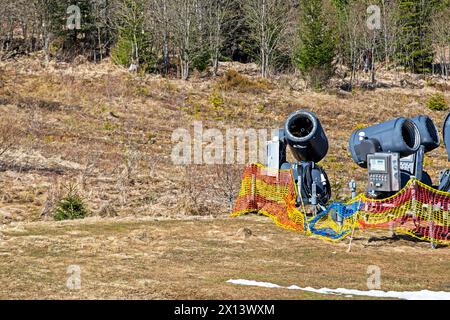 non-working snow generator on a slope without snow gear at a resort on a sunny day. Active recreation Stock Photo