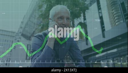 Image of financial data processing over caucasian man using smartphone Stock Photo