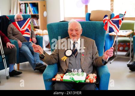 Former World War II squadron leader and Royal Air Force fighter pilot Derrick Grubb celebrates his 100th birthday, which fell last Friday, during a party at the Rowans Hospice Living Well Centre in Waterlooville, Hampshire. Picture date: Monday April 15, 2024. Stock Photo