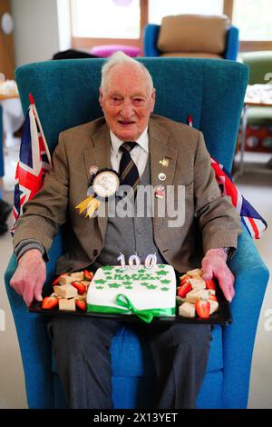 Former World War II squadron leader and Royal Air Force fighter pilot Derrick Grubb celebrates his 100th birthday, which fell last Friday, during a party at the Rowans Hospice Living Well Centre in Waterlooville, Hampshire. Picture date: Monday April 15, 2024. Stock Photo