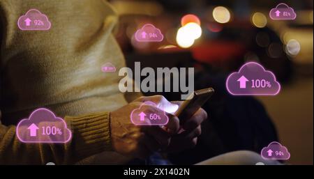 Image of digital clouds with percent going up over man using smartphone Stock Photo
