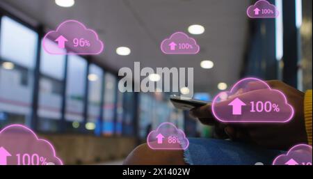 Image of digital clouds with percent going up over man using smartphone Stock Photo