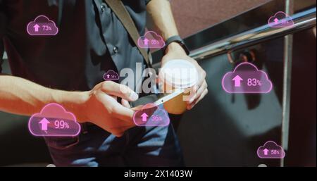 Image of digital clouds with percent going up over man using smartphone Stock Photo