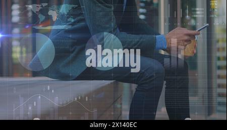 Image of graphs over midsection of caucasian businessman using smartphone Stock Photo