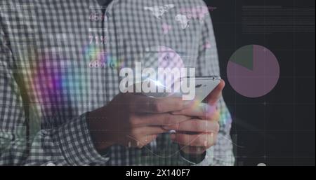 Image of graphs over midsection of caucasian man using smartphone Stock Photo