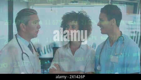 Image of data processing over diverse group of doctors Stock Photo