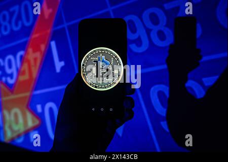 Poland. 15th Apr, 2024. In this photo illustration, a Bitcoin logo is displayed on a smartphone with stock market percentages on the background. Credit: SOPA Images Limited/Alamy Live News Stock Photo