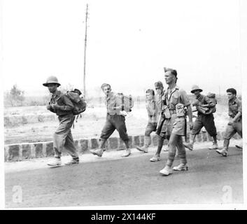 British Army forces escort Italian prisoners to a POW camp during ...