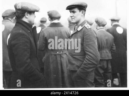 A GERMAN PRISONER-OF-WAR CAMP - Close-ups of types of German prisoners British Army Stock Photo