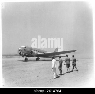 FIELD MARSHAL ALEXANDER IN ATHENS - Mr. Harold Caccia (British Charge d'Affairs) with Air Commodore Tuttle, and Lieut. General Scobie watch the 'plane as it takes off British Army Stock Photo