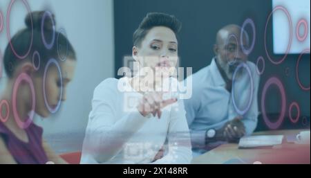 Image of qr code and data processing over diverse business people in office Stock Photo