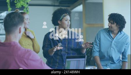Image of icons and data processing over diverse business people in office Stock Photo