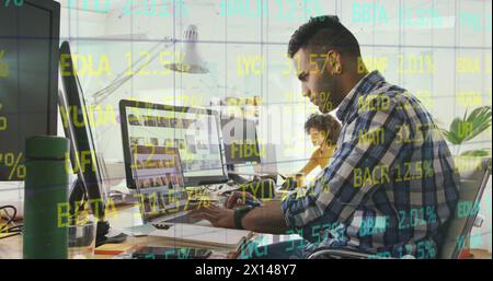 Composite of financial data processing over businessman using computer in office Stock Photo