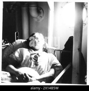 EVACUATION OF GERMAN CONCENTRATION CAMPS INMATES TO SWEDEN - A Polish woman, survivor from the Bergen-Belsen camp, lying in bed aboard ship. The Swedish government agreed to allow 10 000 ex-inmates of Belsen, Buchenwald and other German concentration camps to travel to Sweden and stay there for a period of six months recuperation. Meanwhile UNRRA would try to arrange return to their home countries.They arrived from Belsen at the Cambrai Barracks at Lubeck, Germany, which used to house German soldiers and then became the Swedish Transit Hospital. Here they were desinfected and prepared for the Stock Photo