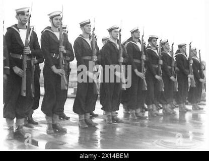 REGENT OF GREECE REVIEWS GREEK FLEET - The crew of the 'Averof' present arms as Archbishop Damaskinos leaves to board his launch British Army Stock Photo