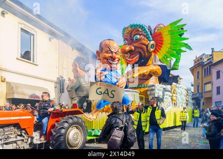 Cantu, Italy - February 25, 2023: Carnival parade, with allegorical figure wagon, in Cantu, Lombardy, Northern Italy Stock Photo