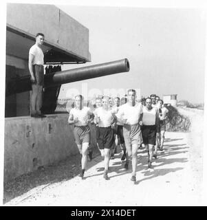 British Army personnel conduct physical training exercises by lifting ...