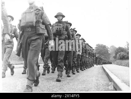 Scots Guards battalion marches in battle order through a town in the ...