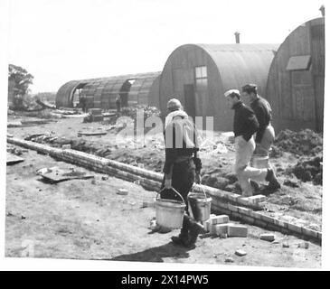Italian prisoners of war are unloading ballast at a POW camp under ...