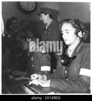 ATS operators at work on a telephone switchboard during an exhibition ...