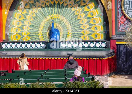 Chinese-style pantomime theatre with large peacock and empty theater seats. Tivoli Gardens, Copenhagen, Denmark Stock Photo