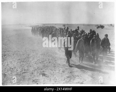 Italian prisoners are marched back by British Army troops during the ...