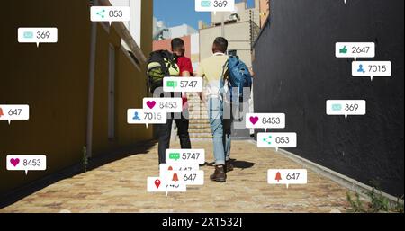 Image of notification bars over diverse friends discussing while walking on street Stock Photo