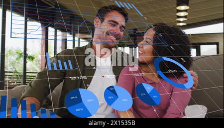 Image of graphs and changing numbers over diverse couple sitting and looking at each other Stock Photo