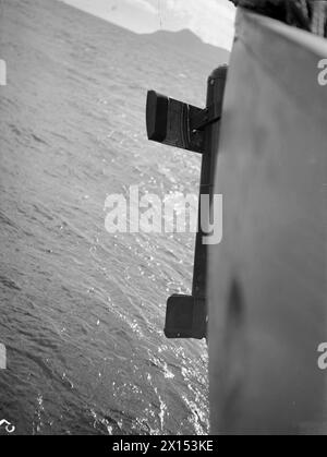 ANTI U-BOAT TORPEDO TRIALS HELD ON BOARD HMS BENTINCK, CAPTAIN CLASS FRIGATE. 5 AND 6 OCTOBER 1943, GREENOCK DISTRICT. - View of the Diverta PV at the stern of the ship when being heaved on board Stock Photo