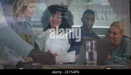 Image of statistics and data processing over smiling diverse colleagues clapping at meeting Stock Photo