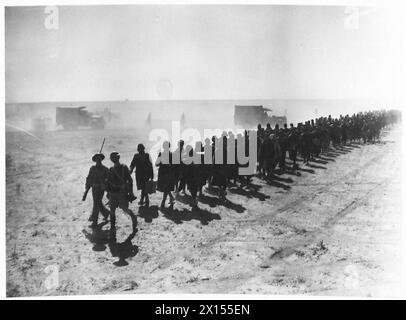 Italian prisoners are marched back by British Army troops during the ...