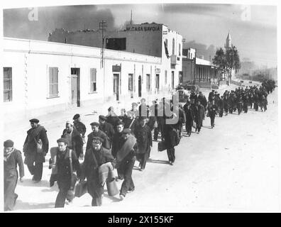 Italian Naval prisoners are marched through Tobruk by British Army ...