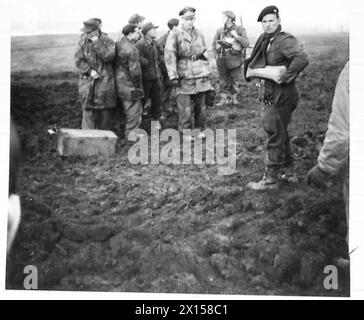 German prisoners are transported across a river after being captured by ...