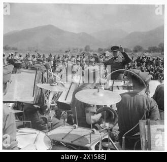 ITALY : ALLIED PIONEERS MEET - This is the attraction - the Band of the Royal Army Service Corps. Bandsman Harry Hall featured during the playing of the 'Post Horn Gallop' British Army Stock Photo