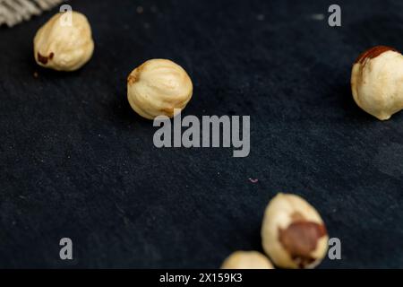 peeled roasted hazelnuts in a wooden bowl, close-up of roasted hazelnuts Stock Photo