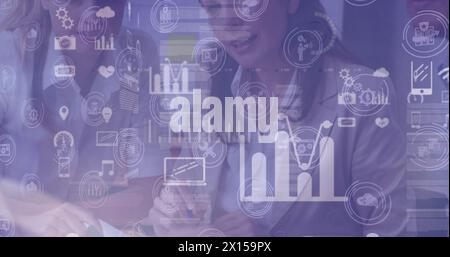 Image of graphs and icons over midsection of caucasian businesspeople in office Stock Photo