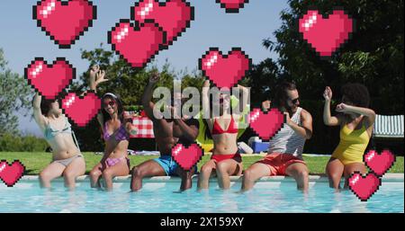 Image of hearts over happy diverse friends at pool party Stock Photo
